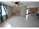 Spacious living area with staircase, tile flooring, and a view of the stone fireplace at 2918 10Th N St, St Petersburg, FL 33704