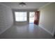 Bright living room boasts textured walls and a cozy window seat by the front door at 2918 10Th N St, St Petersburg, FL 33704