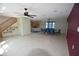 Expansive area featuring a staircase, living space with fireplace, and dining area with large table at 2918 10Th N St, St Petersburg, FL 33704