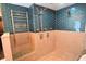 Walk-in shower featuring modern blue tiling and luxurious fixtures at 2918 10Th N St, St Petersburg, FL 33704