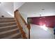 Carpeted staircase leading to the upper level, connecting to a large living space with tile flooring at 2918 10Th N St, St Petersburg, FL 33704