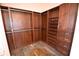 This walk-in closet features custom wood shelving, drawers, and hanging rods for optimal organization at 2918 10Th N St, St Petersburg, FL 33704