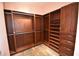 This walk-in closet features custom wood shelving, drawers, and hanging rods for optimal organization at 2918 10Th N St, St Petersburg, FL 33704