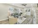 Living room with gray sofa and wood-look floors at 3118 Adrian Ave, Largo, FL 33774