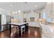 Spacious kitchen featuring white cabinets, granite countertops, and stainless steel appliances at 4615 W El Prado Blvd, Tampa, FL 33629