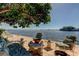 Waterfront patio with seating at 5400 Aloha Dr, St Pete Beach, FL 33706