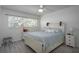 Bright bedroom with a queen-size bed and plenty of natural light at 821 Deleon Ct # 102, Dunedin, FL 34698