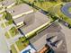 Aerial view of houses with a backyard and driveway at 1028 Orca Ct, Holiday, FL 34691