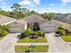 Two-story home with a courtyard entry and two-car garage at 1028 Orca Ct, Holiday, FL 34691