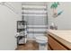 Bathroom with shower/tub combo and wood vanity at 1028 Orca Ct, Holiday, FL 34691
