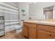 Clean bathroom with wood cabinets and a shower/tub at 1028 Orca Ct, Holiday, FL 34691