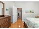 Bedroom with built-in dresser and access to hallway bathroom at 1028 Orca Ct, Holiday, FL 34691