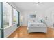 Bedroom with queen-size bed and wood floors at 1028 Orca Ct, Holiday, FL 34691