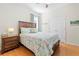 Bedroom with wooden bed and dresser at 1028 Orca Ct, Holiday, FL 34691