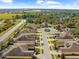 Aerial view of community with houses and roads at 1028 Orca Ct, Holiday, FL 34691