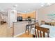 Kitchen with breakfast bar and adjacent dining area at 1028 Orca Ct, Holiday, FL 34691