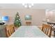 Dining area with a view of Christmas tree and living room at 1028 Orca Ct, Holiday, FL 34691