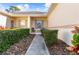 Neat walkway leading to the front entrance at 1028 Orca Ct, Holiday, FL 34691