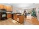 Modern kitchen with stainless steel appliances and light wood cabinets at 1028 Orca Ct, Holiday, FL 34691