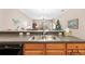 Kitchen sink and countertop with a view into the living area at 1028 Orca Ct, Holiday, FL 34691