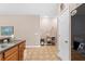 Kitchen with black refrigerator, pantry, and tiled floor at 1028 Orca Ct, Holiday, FL 34691