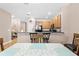 Kitchen features light wood cabinets and breakfast bar at 1028 Orca Ct, Holiday, FL 34691
