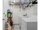 Laundry room with washer, dryer, and ample shelving at 1028 Orca Ct, Holiday, FL 34691