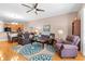 Spacious living room with hardwood floors, comfortable seating, and an open floor plan at 1028 Orca Ct, Holiday, FL 34691