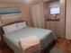 Bright bedroom with a double bed and dresser at 164 Colonial Ct # 19, Palm Harbor, FL 34684