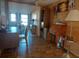 Home office features wood flooring, desk, and built-in shelving at 164 Colonial Ct # 19, Palm Harbor, FL 34684