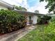 Charming ranch home with landscaped walkway at 1670 Ne Rosery Rd, Largo, FL 33771