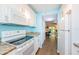 Modern white kitchen with granite countertops and appliances at 211 S Mcmullen Booth Rd # 189, Clearwater, FL 33759