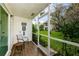 Screened patio with seating and yard view at 211 S Mcmullen Booth Rd # 189, Clearwater, FL 33759