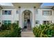 Condo building exterior with stairs and landscaping at 211 S Mcmullen Booth Rd # 189, Clearwater, FL 33759