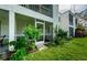 Screened-in patio with lush green plants at 211 S Mcmullen Booth Rd # 189, Clearwater, FL 33759
