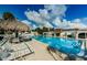 Refreshing community pool area with plenty of lounge chairs at 211 S Mcmullen Booth Rd # 189, Clearwater, FL 33759