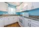 Updated kitchen with white cabinets and granite counters at 211 S Mcmullen Booth Rd # 189, Clearwater, FL 33759