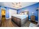 Main bedroom with king-size bed and ceiling fan at 211 S Mcmullen Booth Rd # 189, Clearwater, FL 33759