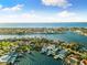 Aerial view of waterfront homes with private docks and boats at 2233 Donato Dr, Belleair Beach, FL 33786