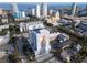 Wide aerial shot of the condominium building surrounded by cityscape and ocean views on a sunny day at 226 5Th N Ave # 706, St Petersburg, FL 33701