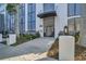Beautiful building entrance with decorative iron gate, manicured landscaping, and modern lighting at 226 5Th N Ave # 706, St Petersburg, FL 33701