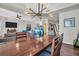 Open concept dining area with hardwood floors and stylish chandelier at 226 5Th N Ave # 706, St Petersburg, FL 33701