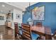 Modern dining area with hardwood floors and blue accent wall at 226 5Th N Ave # 706, St Petersburg, FL 33701