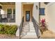 Modern front door entrance with stylish steps and landscaping at 3029 Christophers Watch Ln, Ruskin, FL 33570