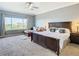 Large main bedroom with king-size bed, sitting area, and abundant natural light at 7287 Islamorada Cir, Seminole, FL 33777