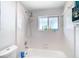 Clean bathroom with a shower/tub combo and white tile at 14376 83Rd Pl, Seminole, FL 33776