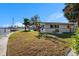 Large backyard with grassy area and waterfront access at 15336 Harbor Dr, Madeira Beach, FL 33708