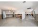 Renovation project: Dining room with a modern chandelier and terrazzo floors at 15336 Harbor Dr, Madeira Beach, FL 33708