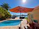 Inviting pool area with patio furniture, offering water views and a relaxing outdoor space at 16126 4Th E St, Redington Beach, FL 33708