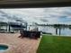 Tranquil dockside view with boat and seating area at 16126 4Th E St, Redington Beach, FL 33708